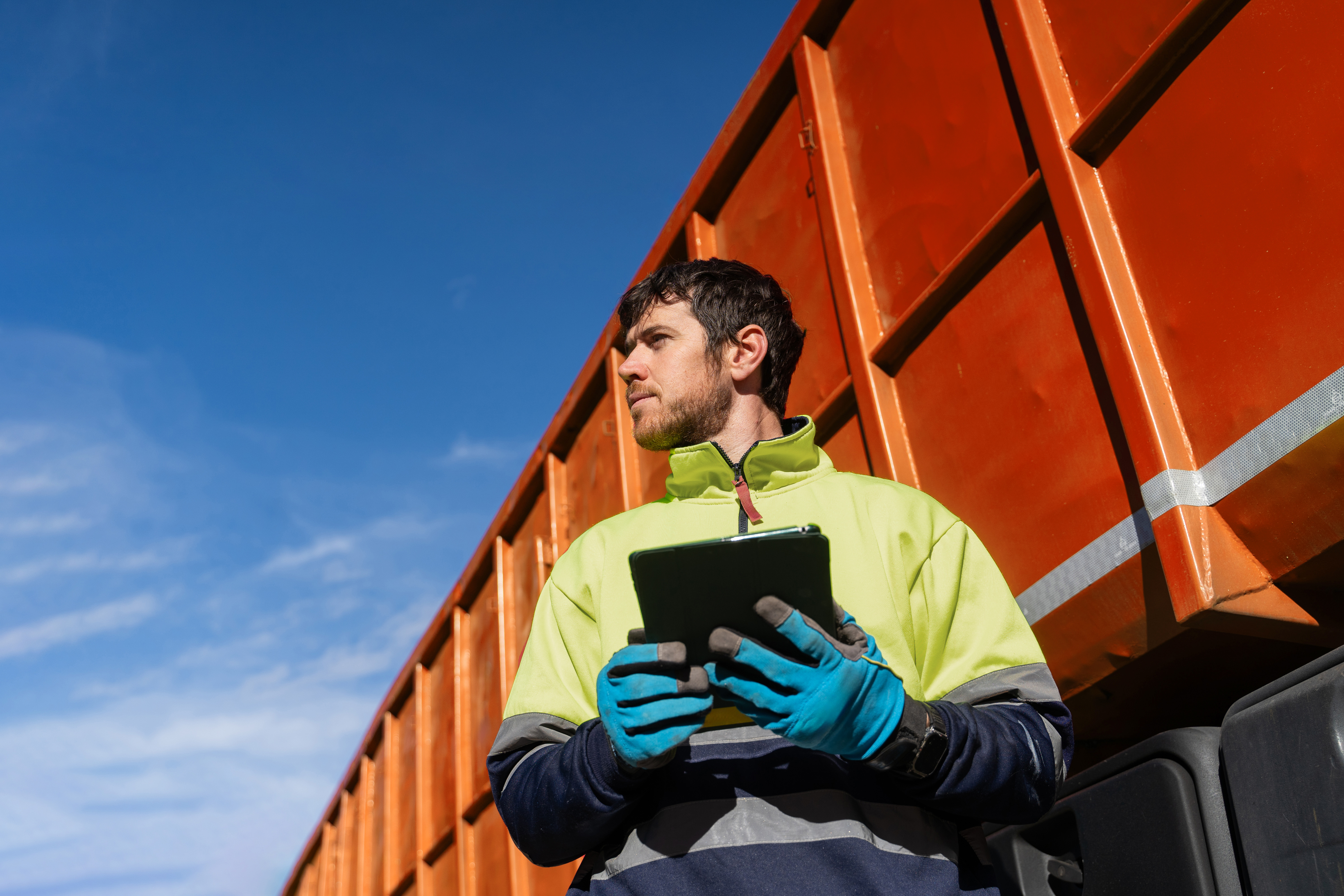 Factory floor worker holding tablet